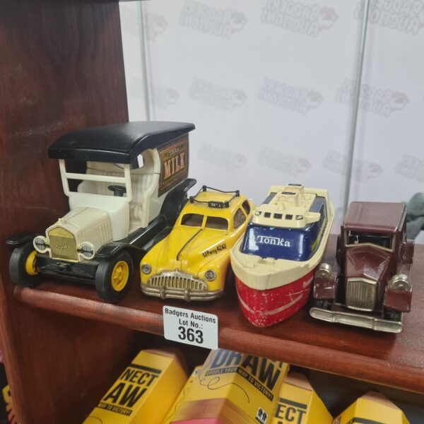 Mixed lot of vintage diecast model vehicles including Tonka truck.