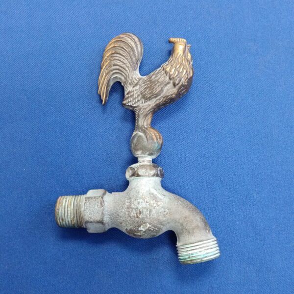 Vintage brass cockerel tap with floral details.