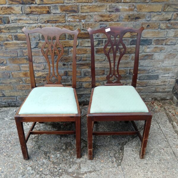 Pair of antique liar back dining chairs with upholstered seats.