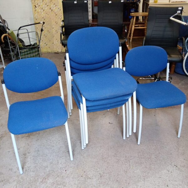 Stack of six vintage Gersham blue fabric chairs.