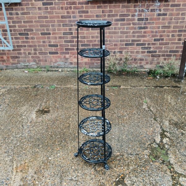 Aluminium tiered garden plant pot stand for displaying flowers.