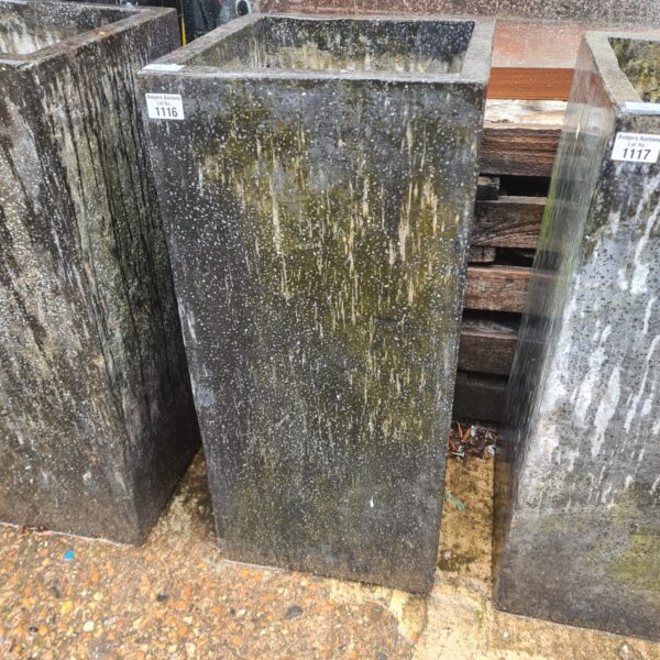 Large granite stone planter for garden display.