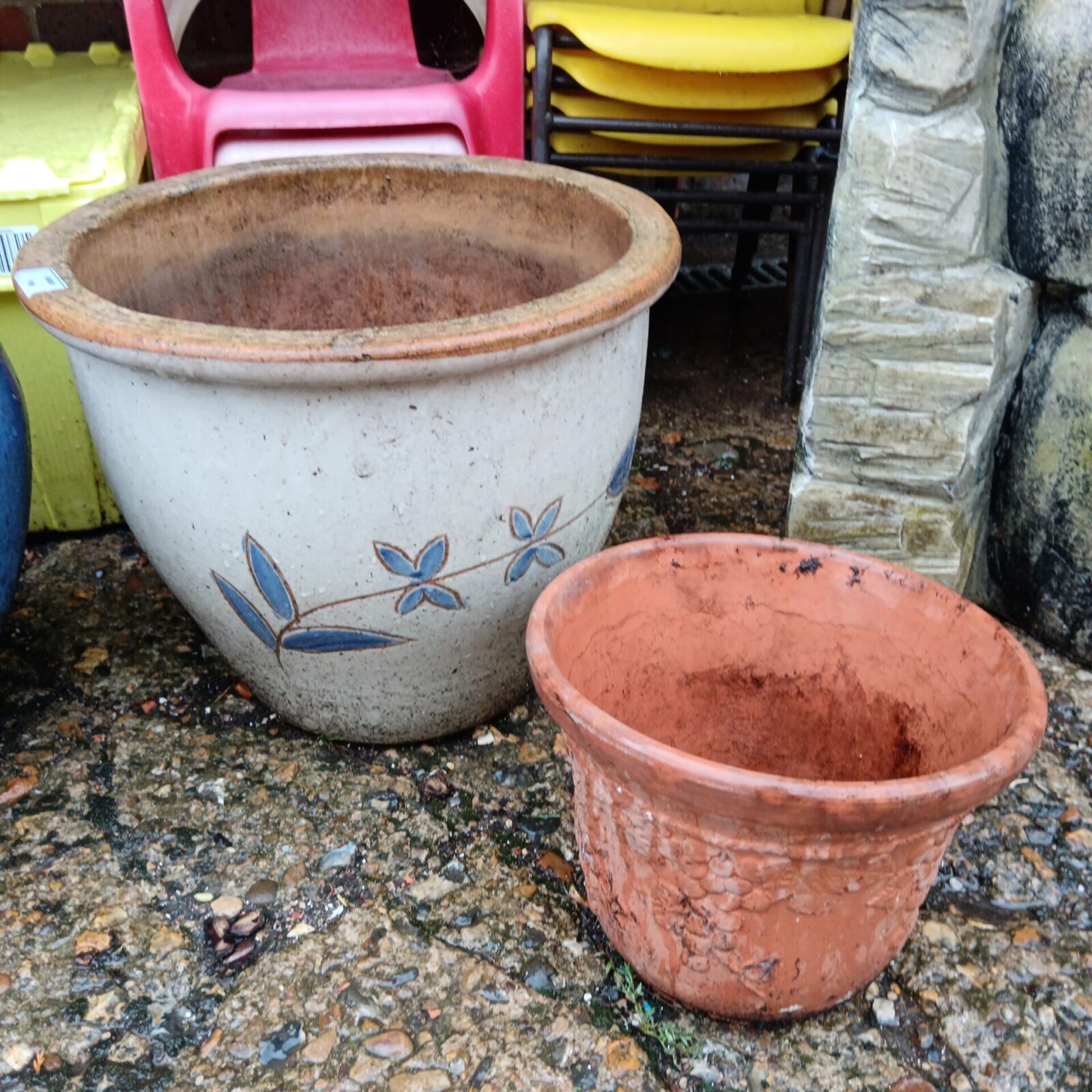Large floral pattern plant pot & small terracotta pot