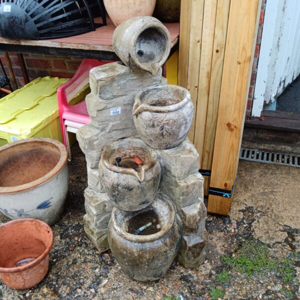 Tiered fibreglass garden water feature with cascading bowls.