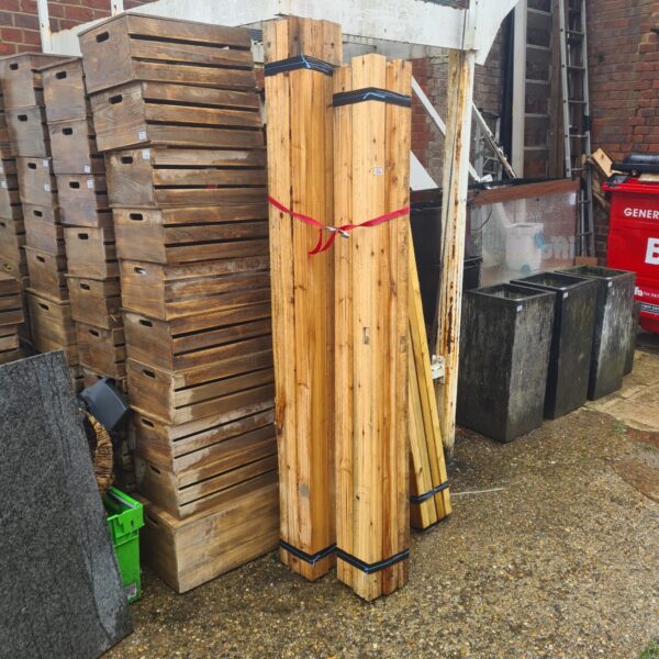 Three bundles of timber for construction and DIY projects.