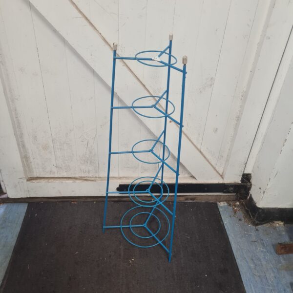 Vintage metal retro pot stand for displaying plants.