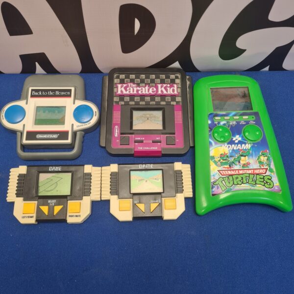 Selection of vintage and retro handheld game consoles inc konami, remco and grandstand