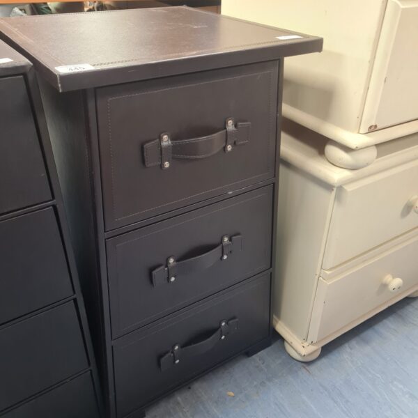 Faux leather three-drawer storage unit for bedroom or office.