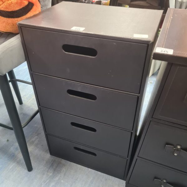 Vintage leather four drawer storage unit for office organisation.