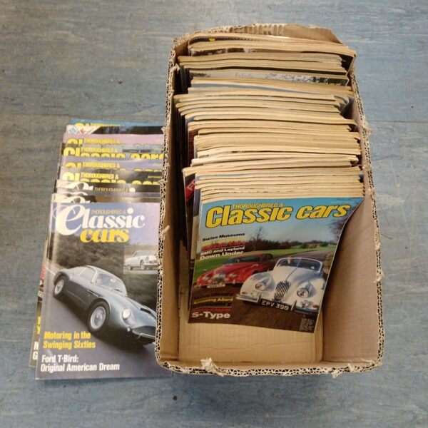 Stack of vintage *Thoroughbred Classic Car* magazines for collectors.