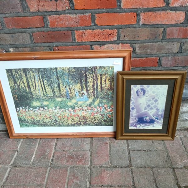Framed Monet-style landscape print with figures in a floral setting.