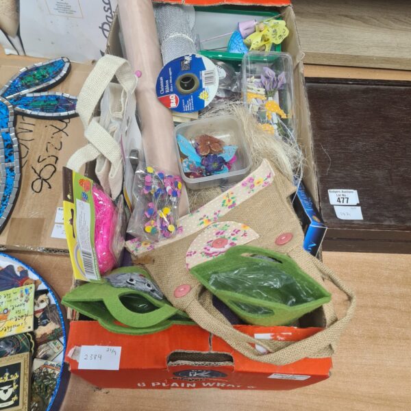 Mixed arts and crafts lot with ribbons, beads, and embellishments.