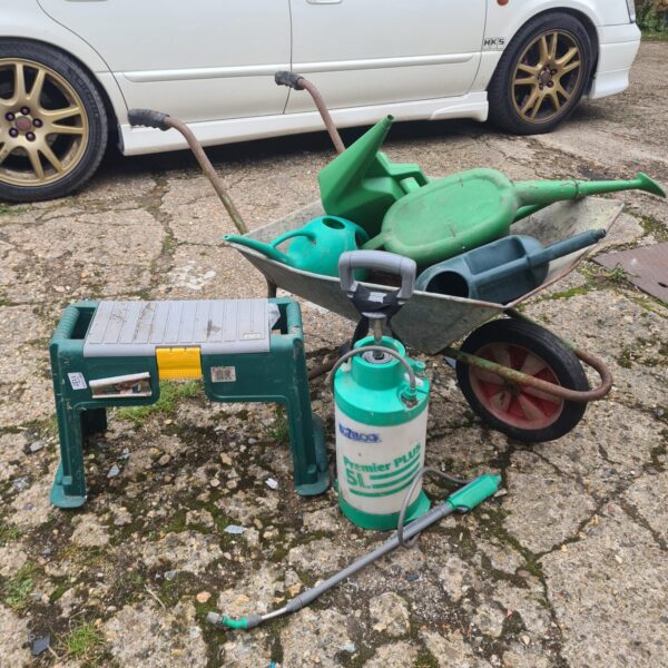 Garden wheelbarrow with mixed gardenware inc hozelock sprayer and watering cans