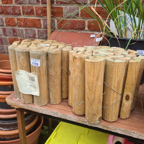 Pair of weathered wooden border rolls for garden edging.