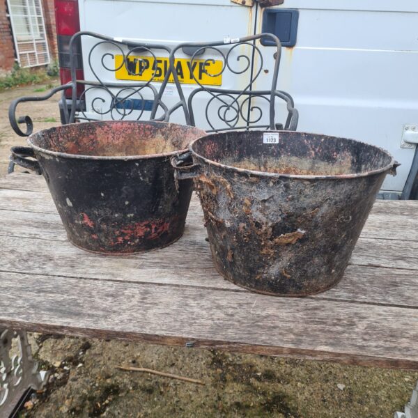 Two vintage cast iron buckets