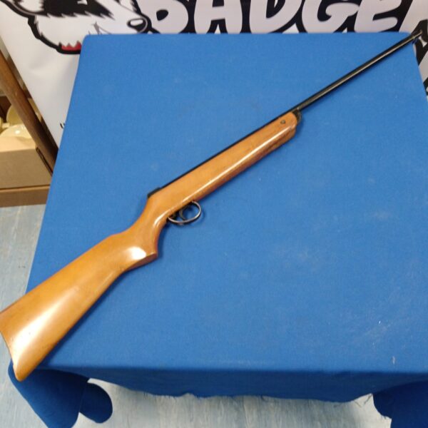 Vintage BSA Meteor .22 air rifle on blue background.