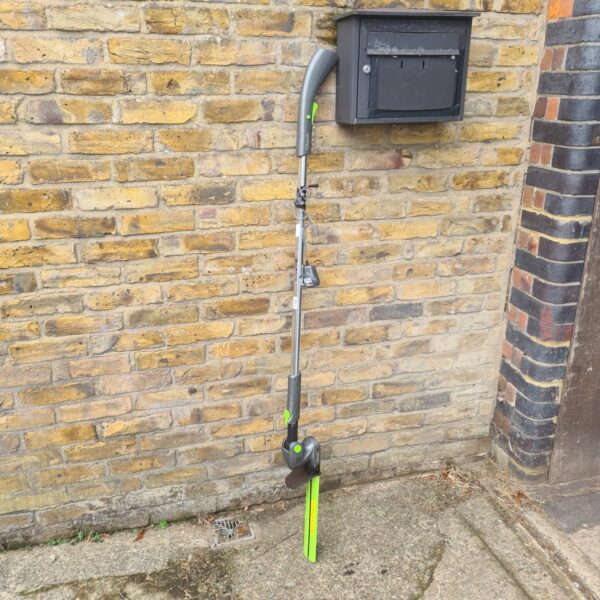 Gtech cordless hedge cutter for garden maintenance and shrub trimming.