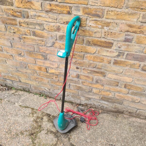 Bosch electric strimmer for garden maintenance and trimming grass.