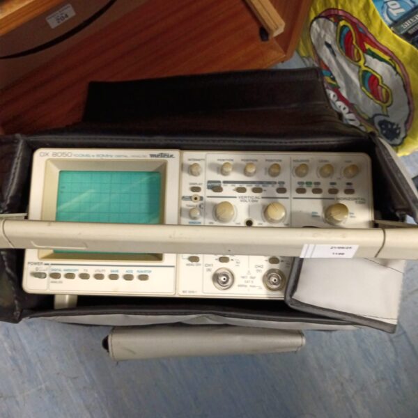 Vintage Meteix ox 8050 oscilloscope with control knobs and display.