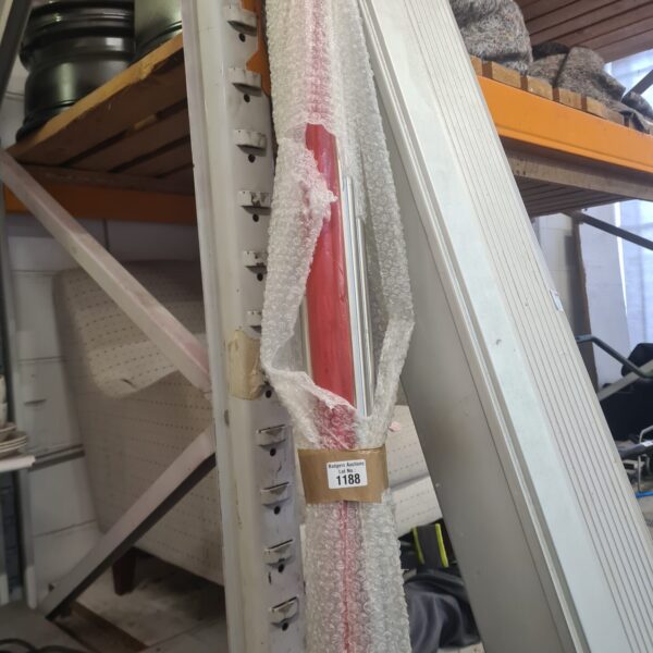 Silver steel tubing bundle wrapped in bubble wrap.