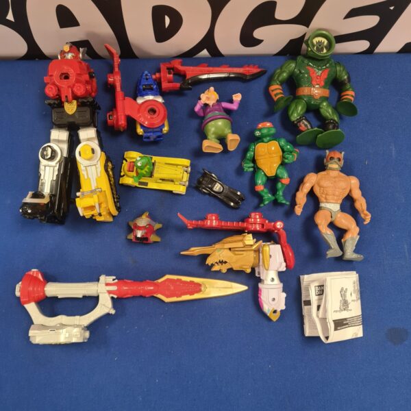 Vintage toy lot featuring Ninja Turtles and Power Rangers action figures.