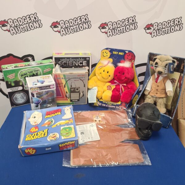 Vintage toy lot featuring radio, Danger Mouse badges, and Funko Pop.