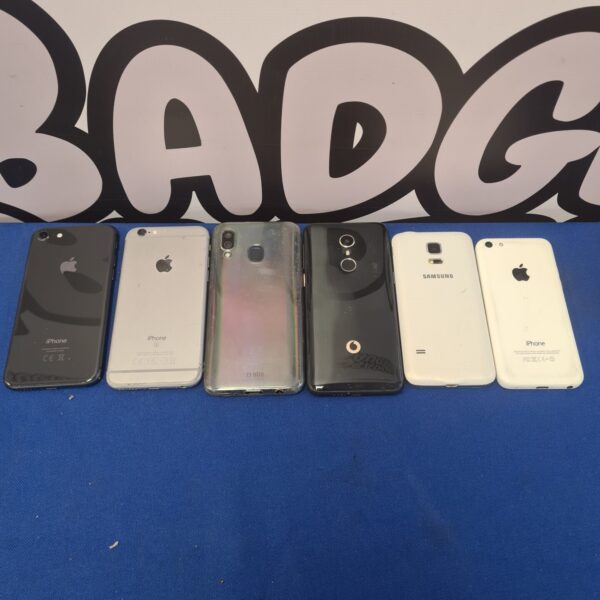Mixed lot of used mobile phones including Apple and Samsung.
