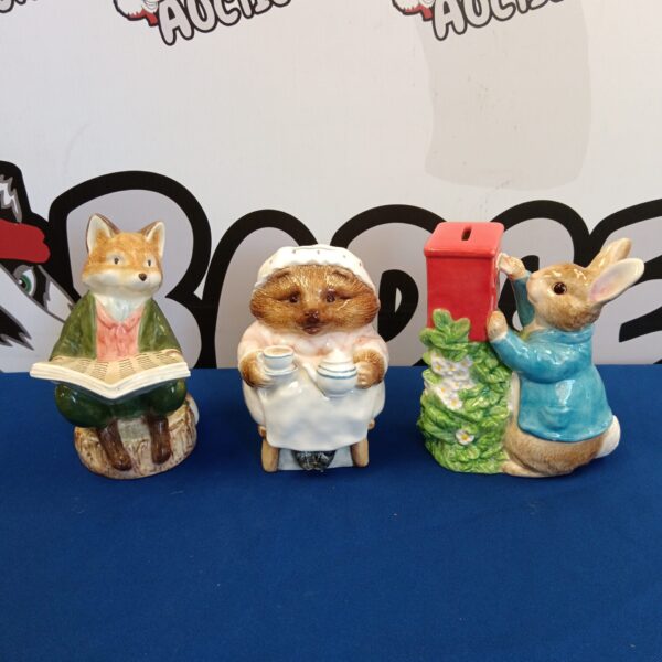 Benjamin Bunny reading a book moneybox by Border Fine Arts.
