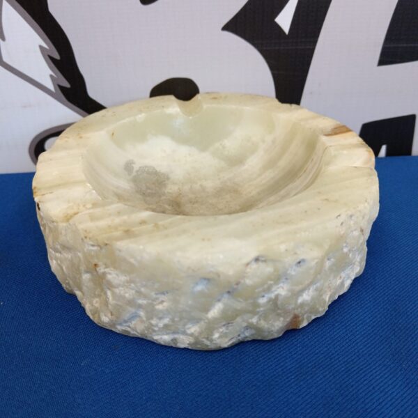 Vintage marble ashtray with natural veining, a classic collectible.