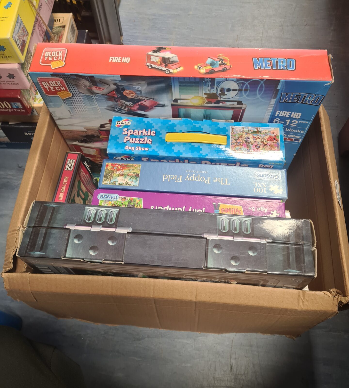 Box of mixed games and puzzles