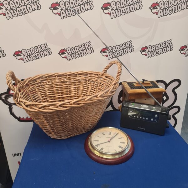Vintage Roberts radio and Memolux clock in a wicker basket.
