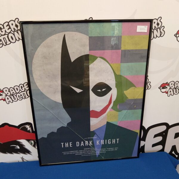 Framed Dark Knight movie poster, a striking piece of film memorabilia.