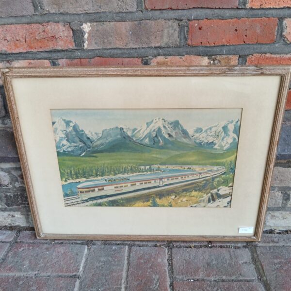 Vintage 1954 Canadian train advertising print in a framed setting.