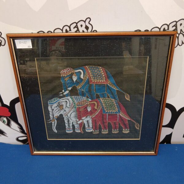 Detailed vintage Indian elephant fabric painting with ornate designs.
