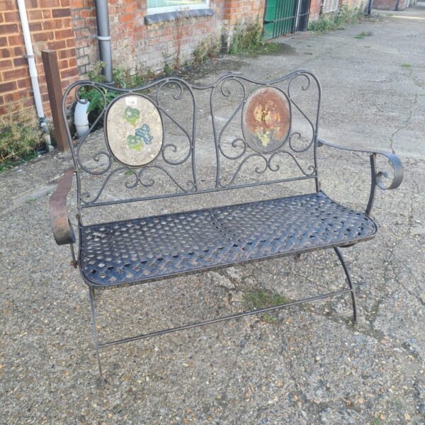 Vintage cast iron garden bench with floral details.
