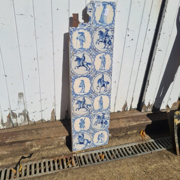 Antique Delft Dutch tiles depicting mounted figures in blue and white.