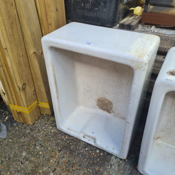 Vintage ceramic Belfast sink with a deep basin.