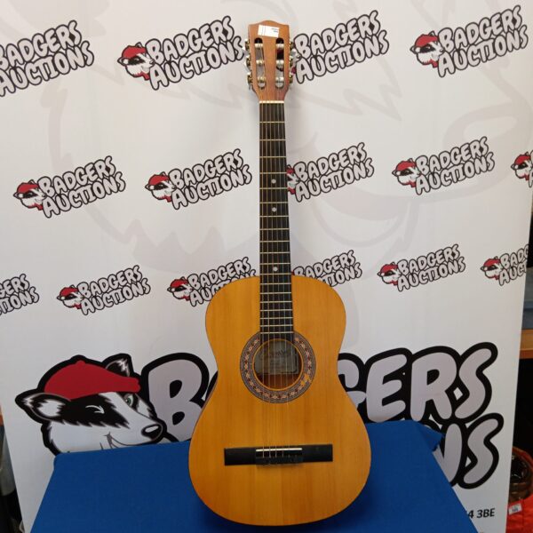 Natural finish Encore child's acoustic guitar for beginners.