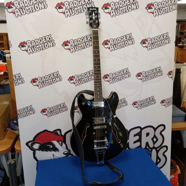 Black Harley Benton electric guitar with whammy bar for sale.
