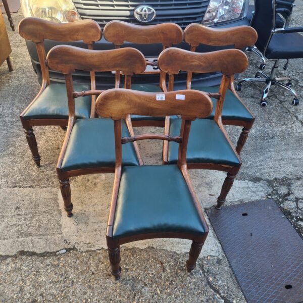 Set of six antique tulip back mahogany dining chairs.