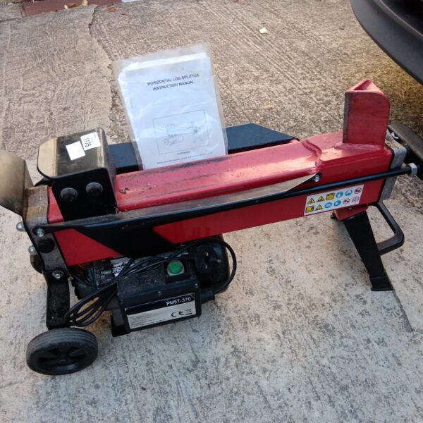 Horizontal log splitter for garden use, showing hydraulic ram and steel frame.