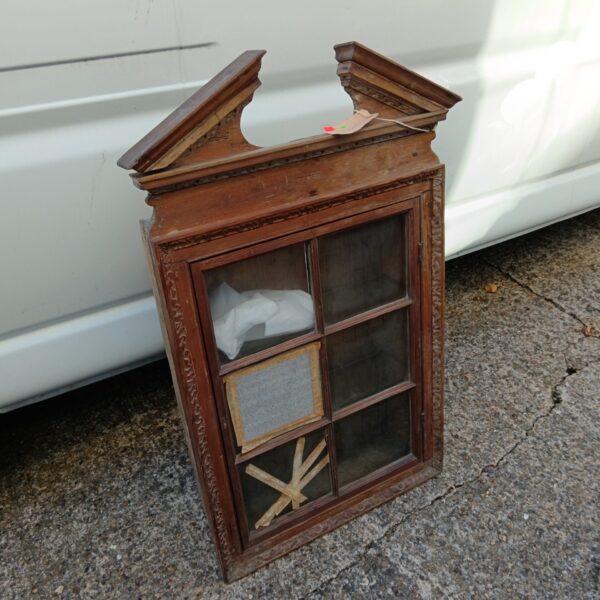 Antique Arts and Crafts display cabinet with glass front and mahogany finish.