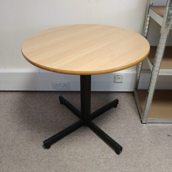Round beech effect table with metal base, ideal for dining or coffee.