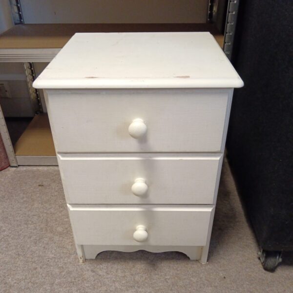 Shabby chic pine chest of drawers for bedroom storage.