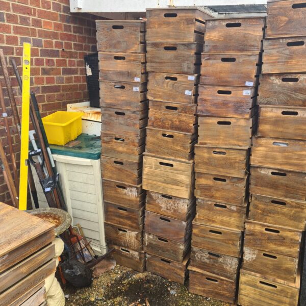Lot of ten vintage wooden storage boxes with lids.