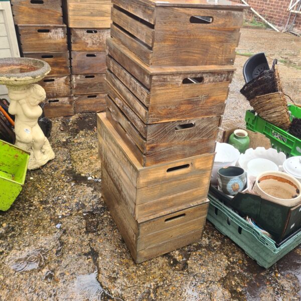 Lot of five rustic wooden storage boxes with lids.