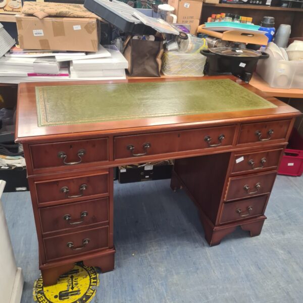 Victorian bankers desk with green leather top and mahogany finish.