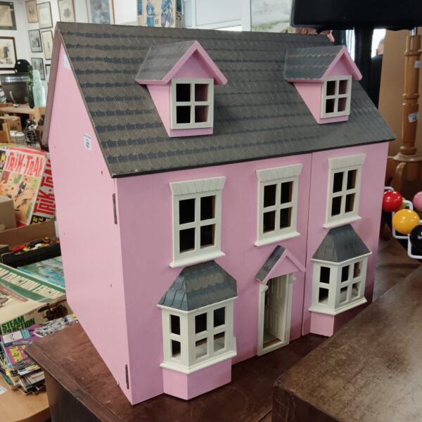 Large pink vintage dolls house for collectors and play.