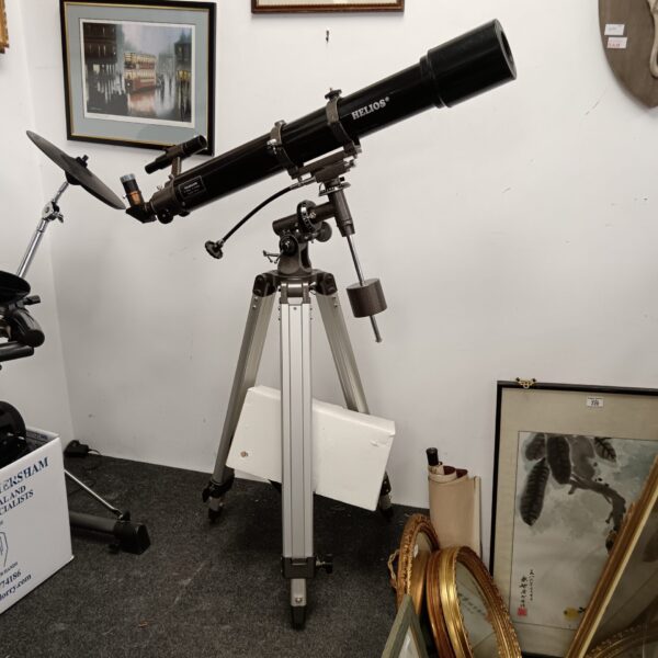 Vintage Helios telescope on tripod with accessories box.