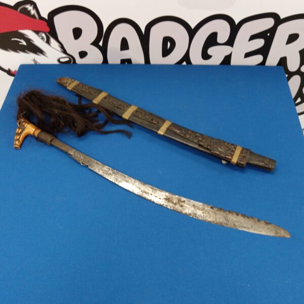 Vintage African tribal sword with bone and hair grip.